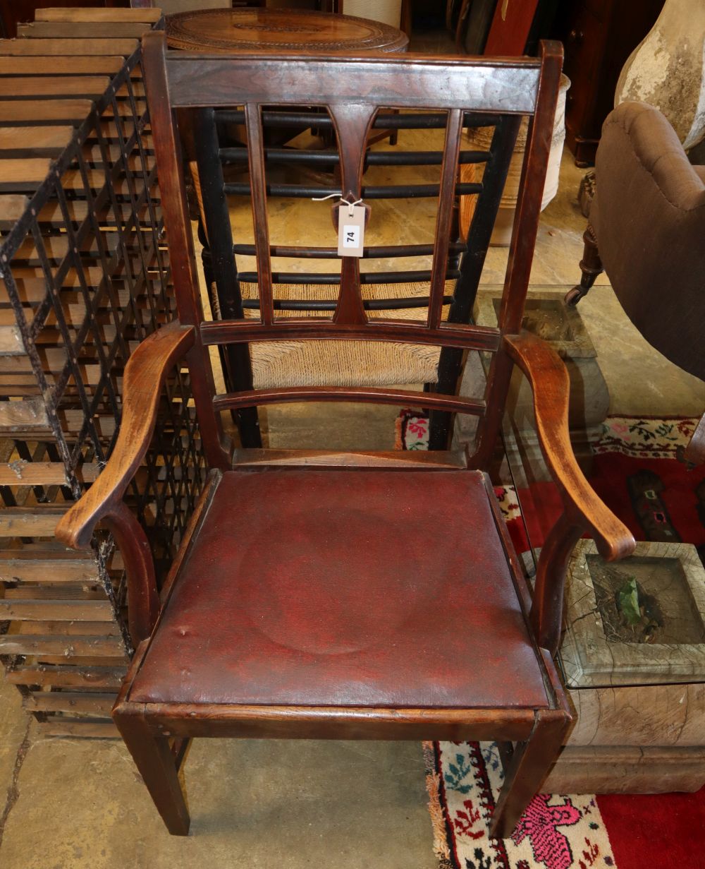 A George III Provincial elm elbow chair